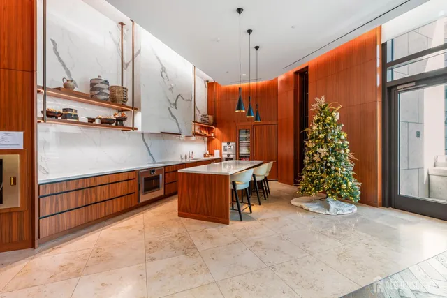 a very nice looking dining room with a large window