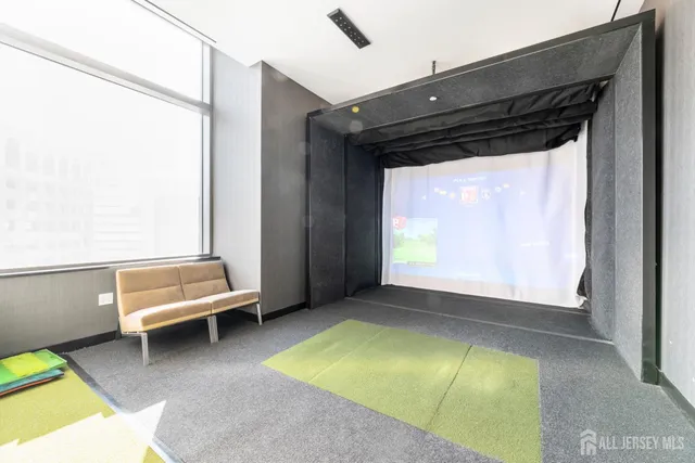 a kitchen with sink and view of living room