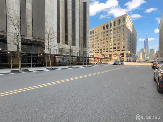 a kitchen with a sink and a refrigerator