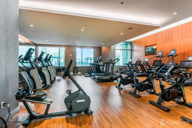 a kitchen with stainless steel appliances and white cabinets