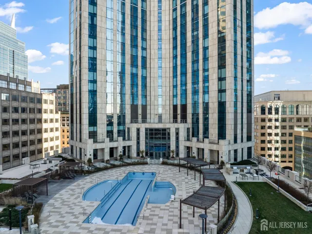 a view of swimming pool with outdoor seating