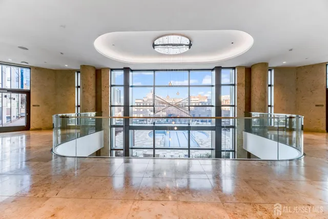 a large room with large windows and furniture