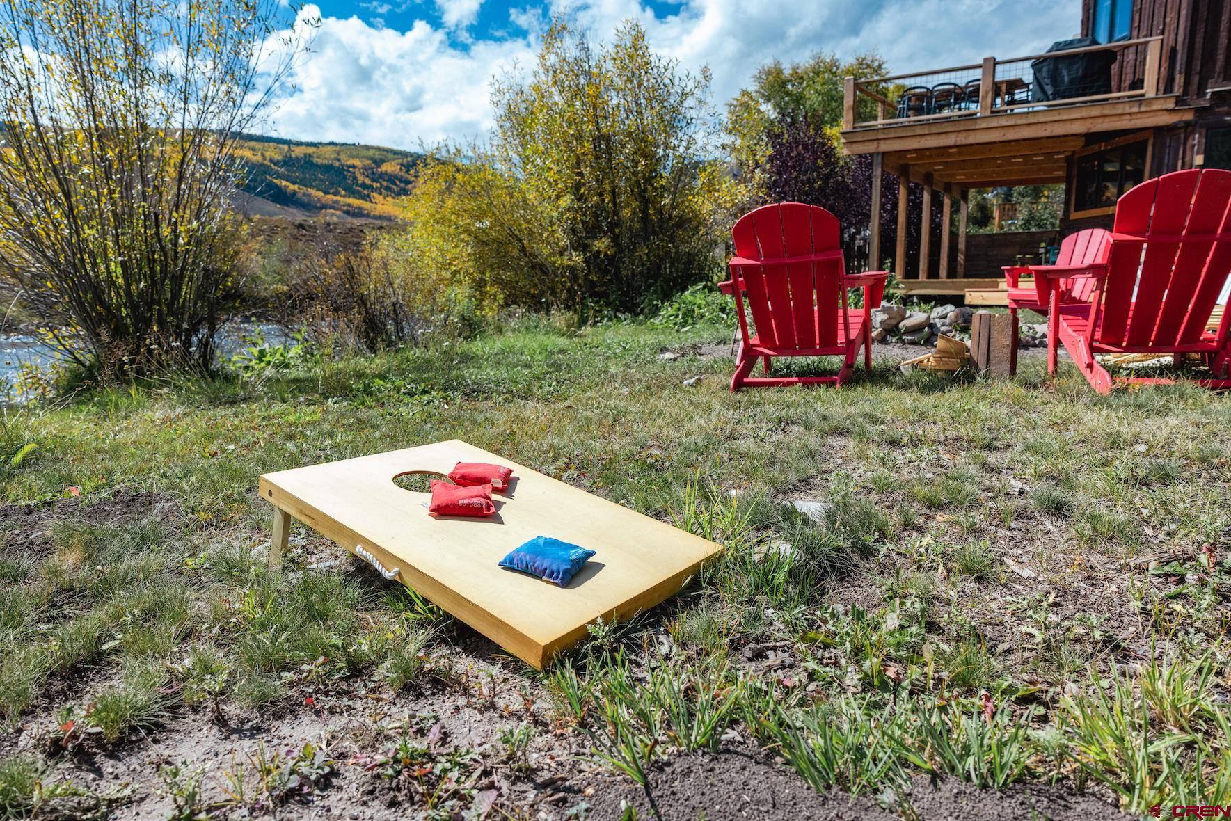246 Lower Allen Road Crested Butte, CO 81224 - Photo 23 of 26 a view of a backyard with sitting area and furniture