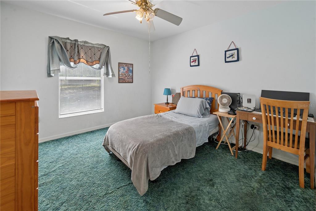 1750 Southwest 15th Street Bell, FL 32619 - Photo 20 of 34 a bedroom with a bed and a window