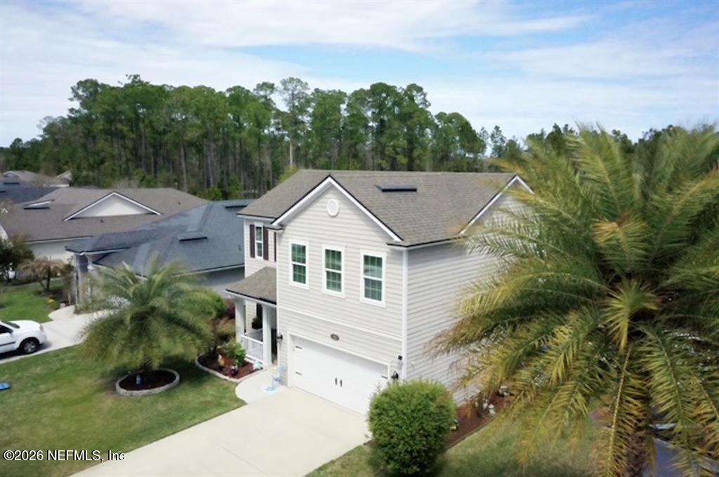 115 Sierras Loop St. Augustine, FL 32086 - Photo 54 of 65 an aerial view of a house with a yard