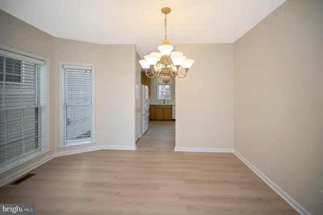 a view of a chandelier in an empty room