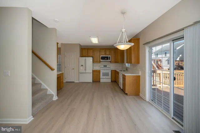 a view of a kitchen cabinets and wooden floor