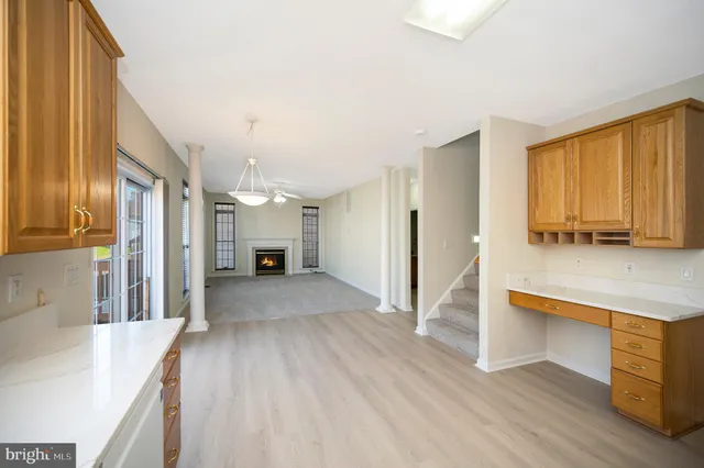 a view of a kitchen cabinets and wooden floor