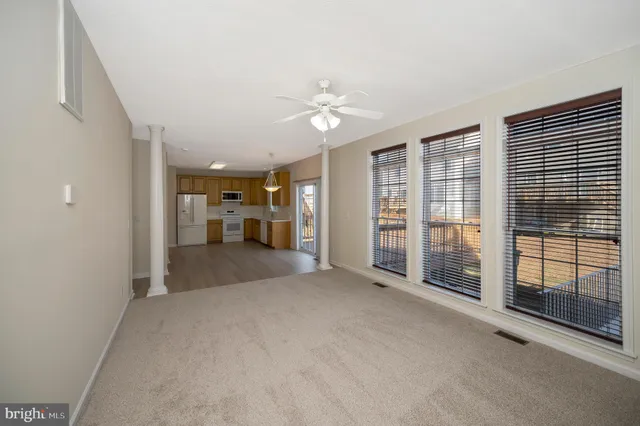 a view of a livingroom with furniture and windows