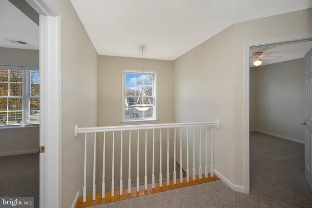 a view of a hallway with windows