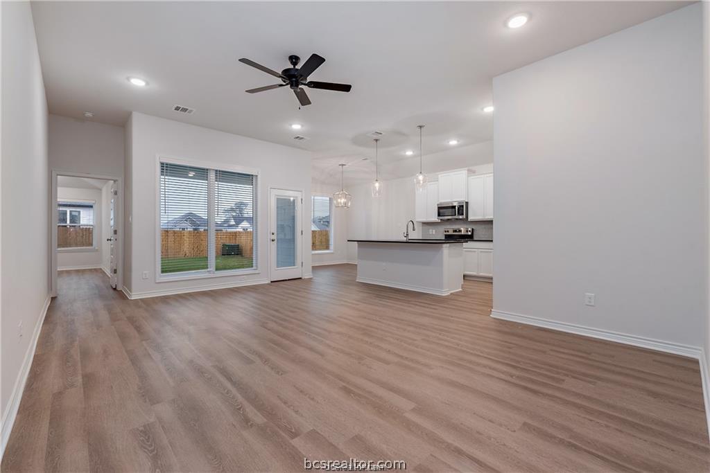 3161 Tarleton Court Bryan, TX 77808 - Photo 5 of 23 a view of a kitchen with wooden floor and a kitchen