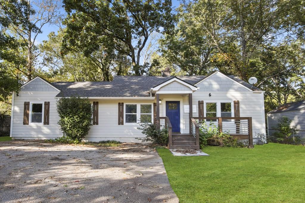 3378 Glenwood Road Decatur, GA 30032 - Photo 1 of 1 a front view of a house with a garden