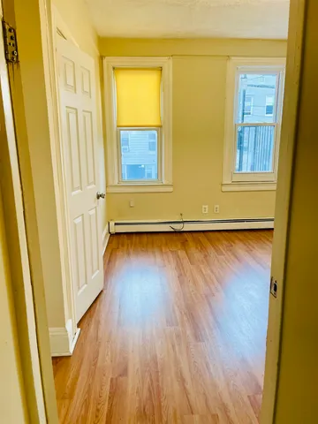 a view of front door with wooden floor