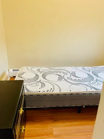 a bedroom with a bed and lamp