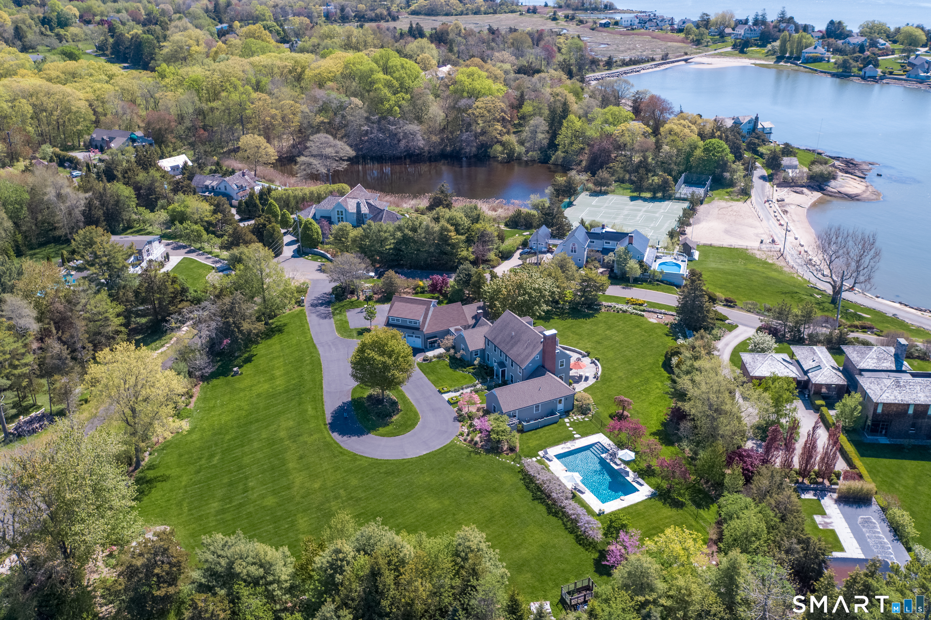 28 Walden Hill Road Guilford, CT 06437 - Photo 2 of 35 an aerial view of a house with a garden and lake view