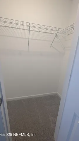 a view of small space with racks on the wall