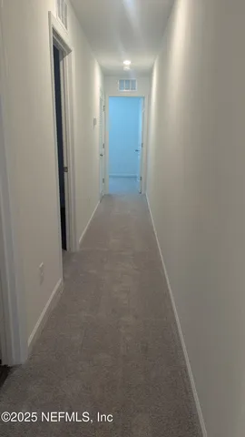 an empty room with a empty space and window