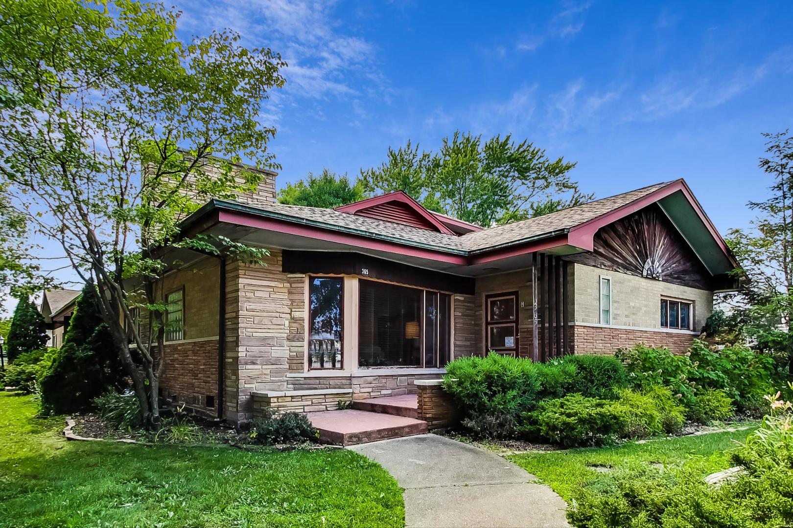 365 Lionel Road Riverside, IL 60546 - Photo 1 of 35 a front view of a house with garden