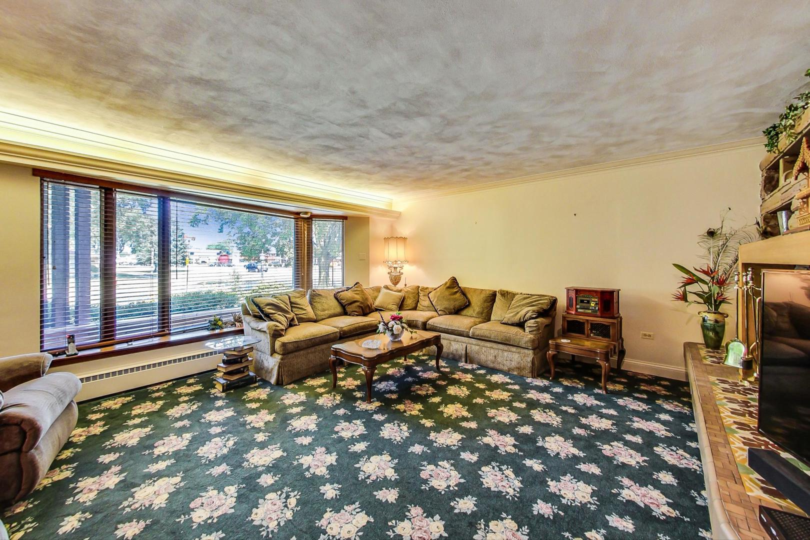 365 Lionel Road Riverside, IL 60546 - Photo 2 of 35 a living room with furniture large window and flat screen tv