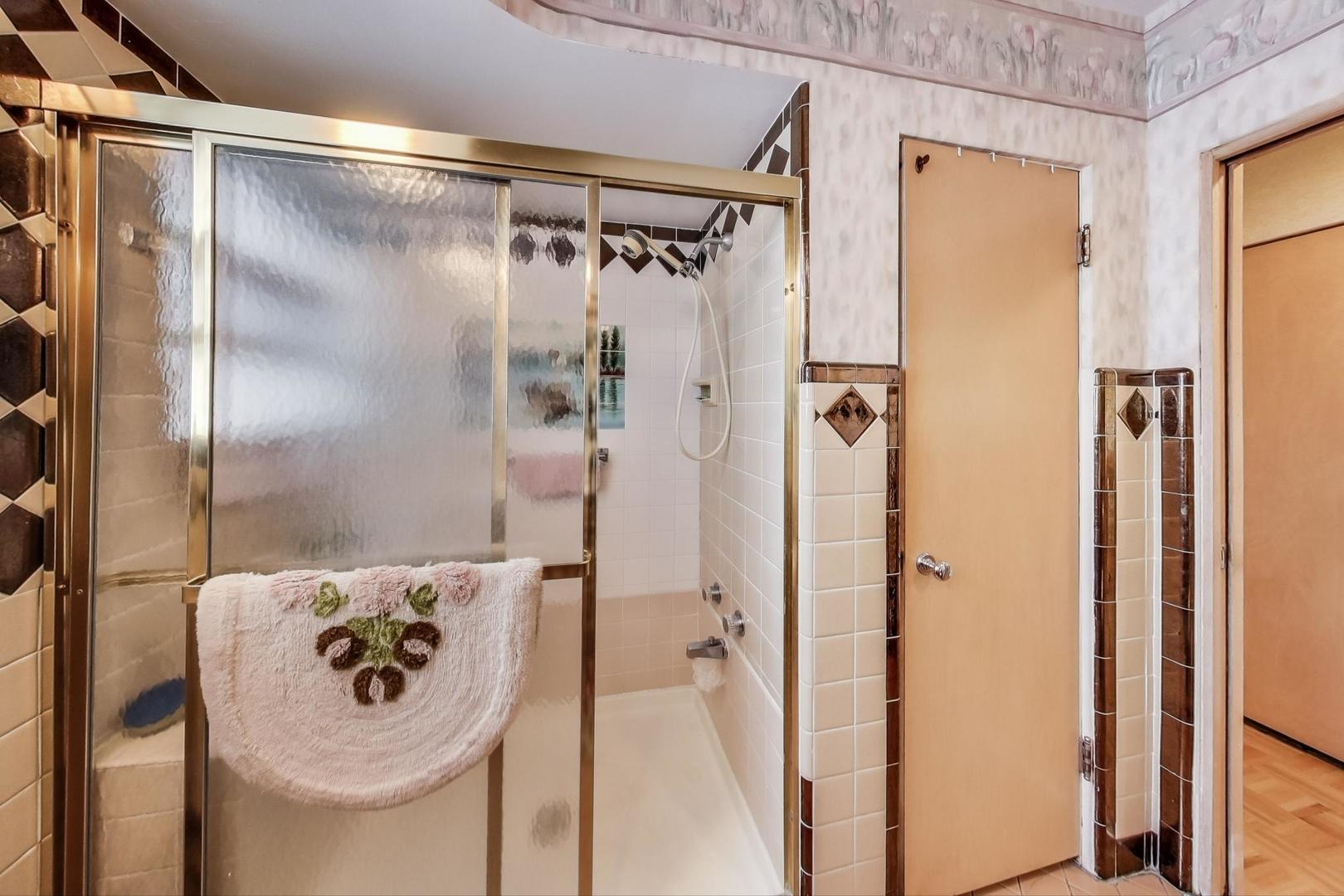 365 Lionel Road Riverside, IL 60546 - Photo 14 of 35 a bathroom with a shower and a mirror