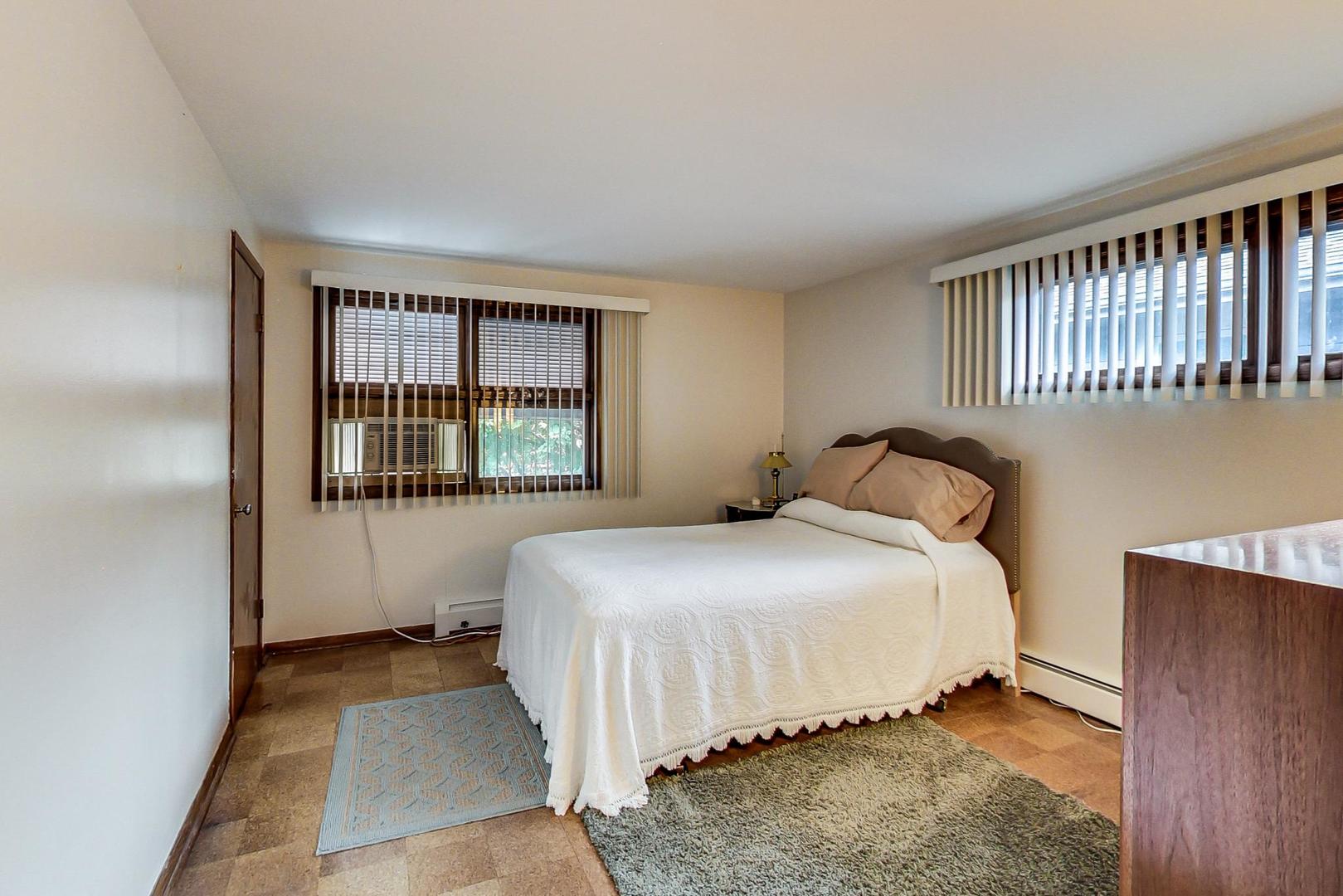 365 Lionel Road Riverside, IL 60546 - Photo 15 of 35 a bedroom with a bed and a window