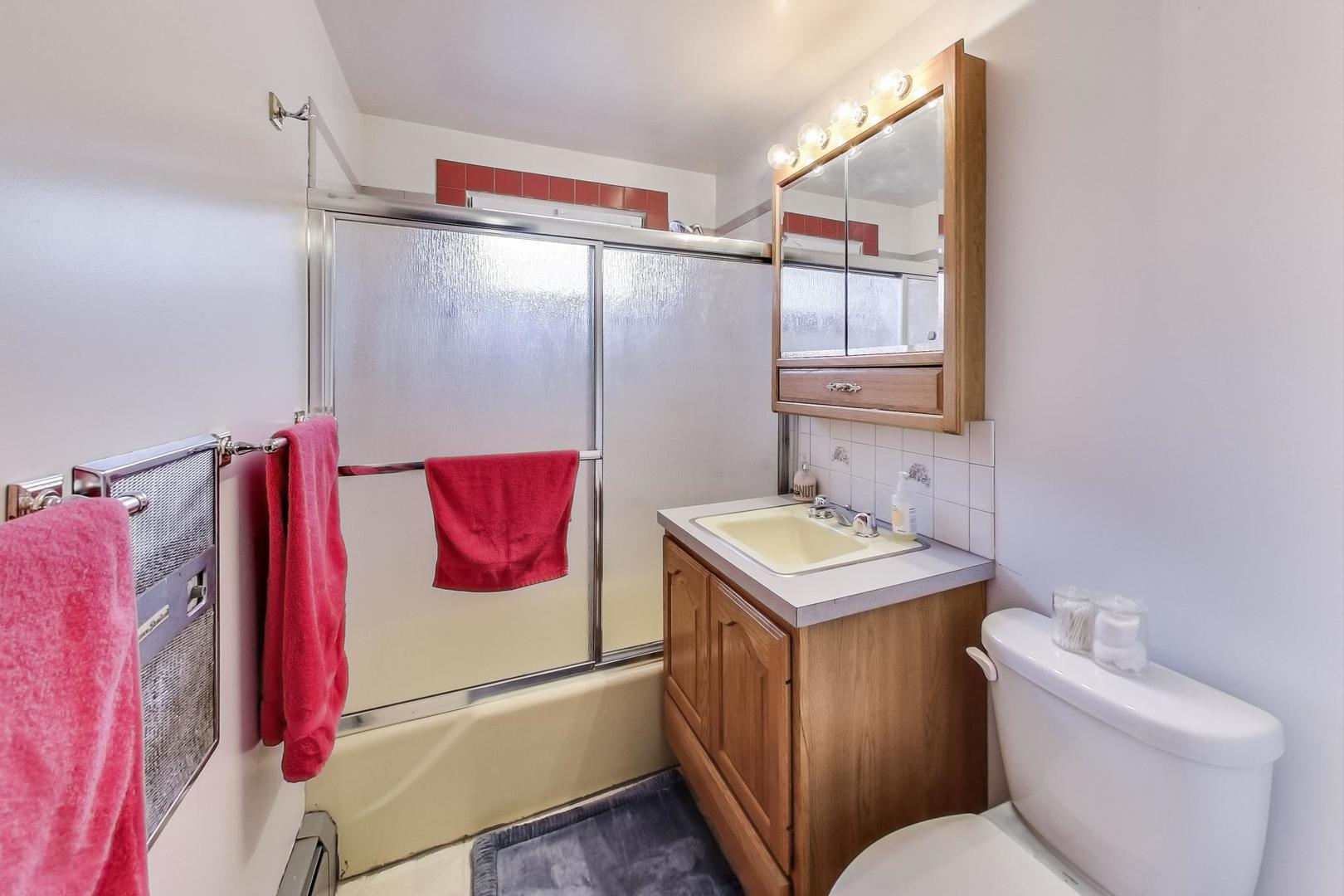 365 Lionel Road Riverside, IL 60546 - Photo 16 of 35 a bathroom with a sink vanity mirror and toilet
