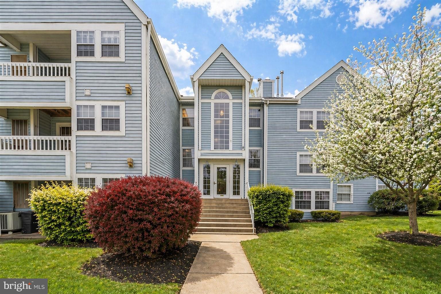 8353 Montgomery Run Road, Unit F Ellicott City, MD 21043 - Photo 1 of 25 a front view of a house with a yard