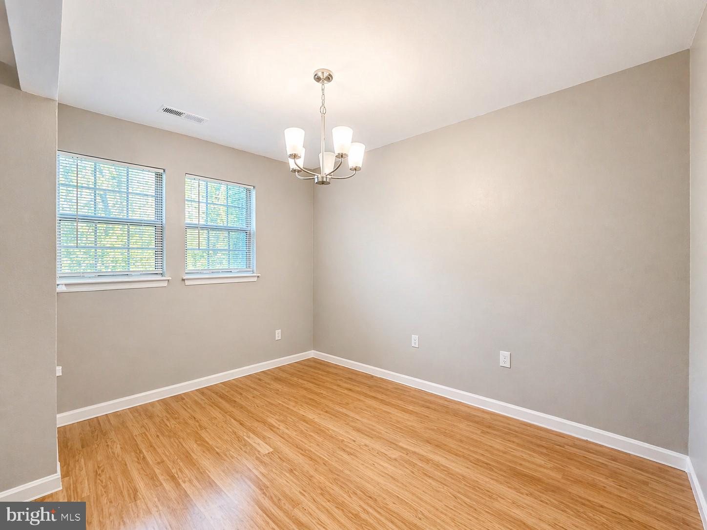 8353 Montgomery Run Road, Unit F Ellicott City, MD 21043 - Photo 11 of 25 a view of empty room with wooden floor