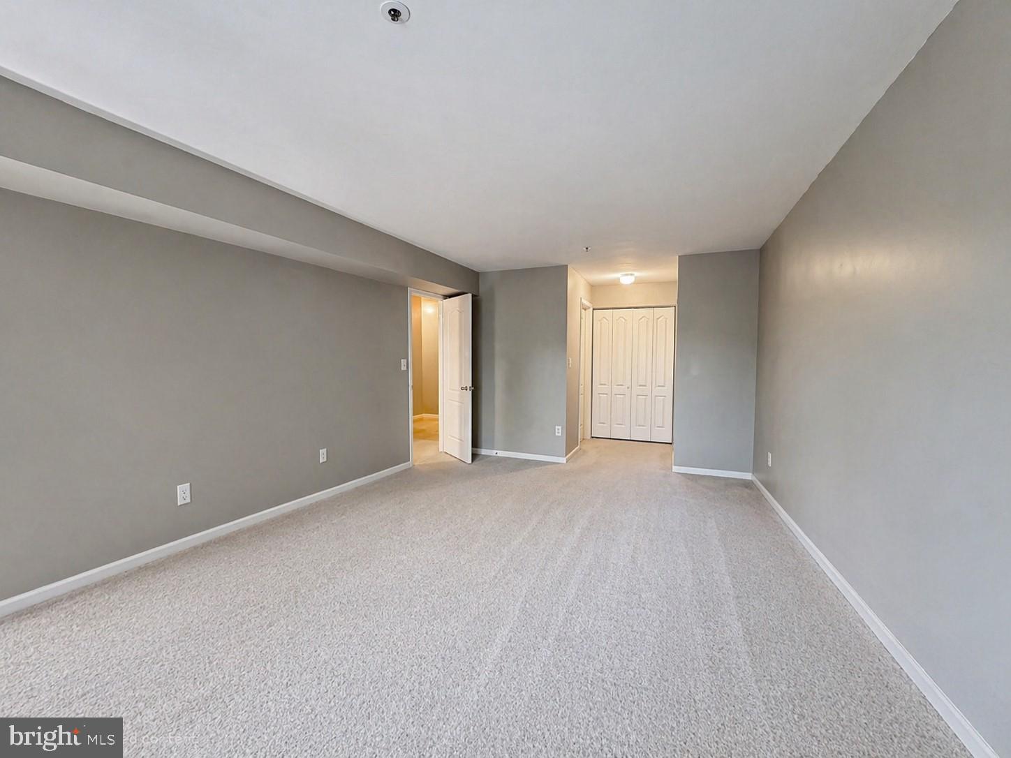 8353 Montgomery Run Road, Unit F Ellicott City, MD 21043 - Photo 14 of 25 a view of an empty room with a window