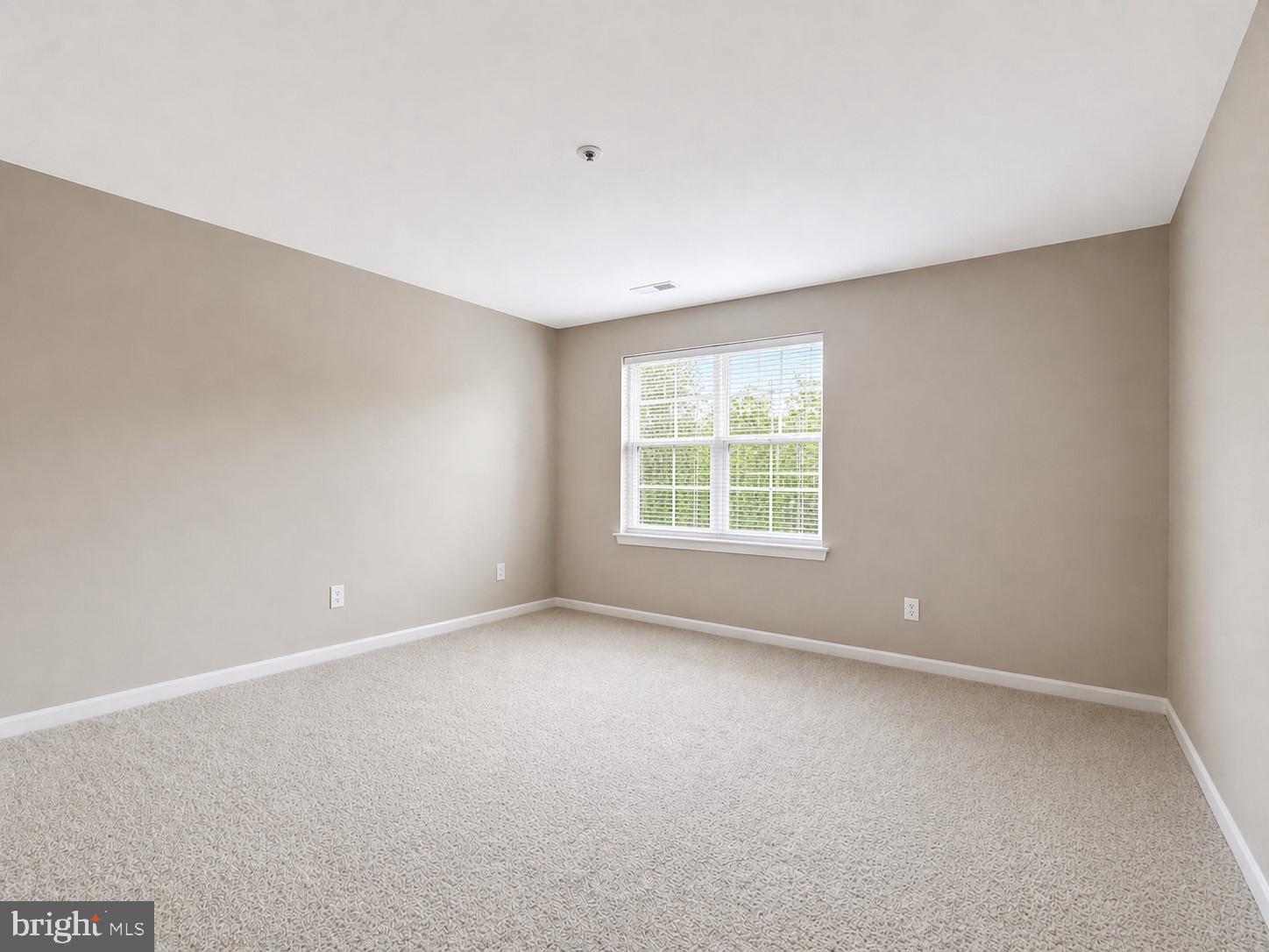 8353 Montgomery Run Road, Unit F Ellicott City, MD 21043 - Photo 17 of 25 an empty room with a window