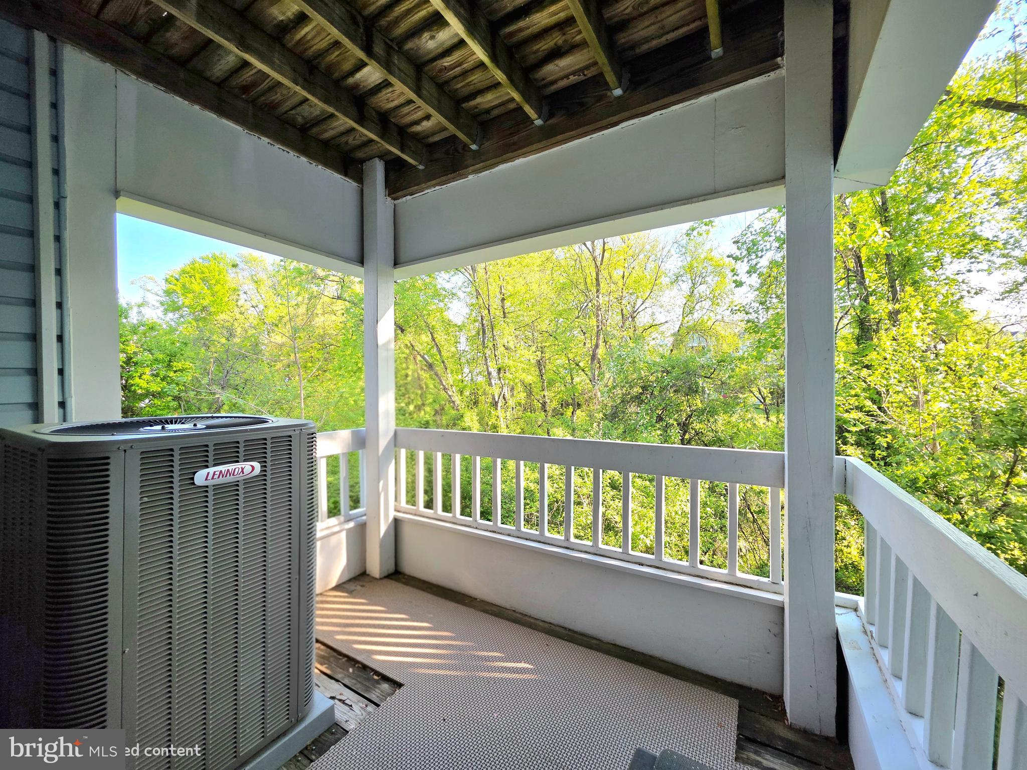 8353 Montgomery Run Road, Unit F Ellicott City, MD 21043 - Photo 20 of 25 a view of balcony with wooden floor