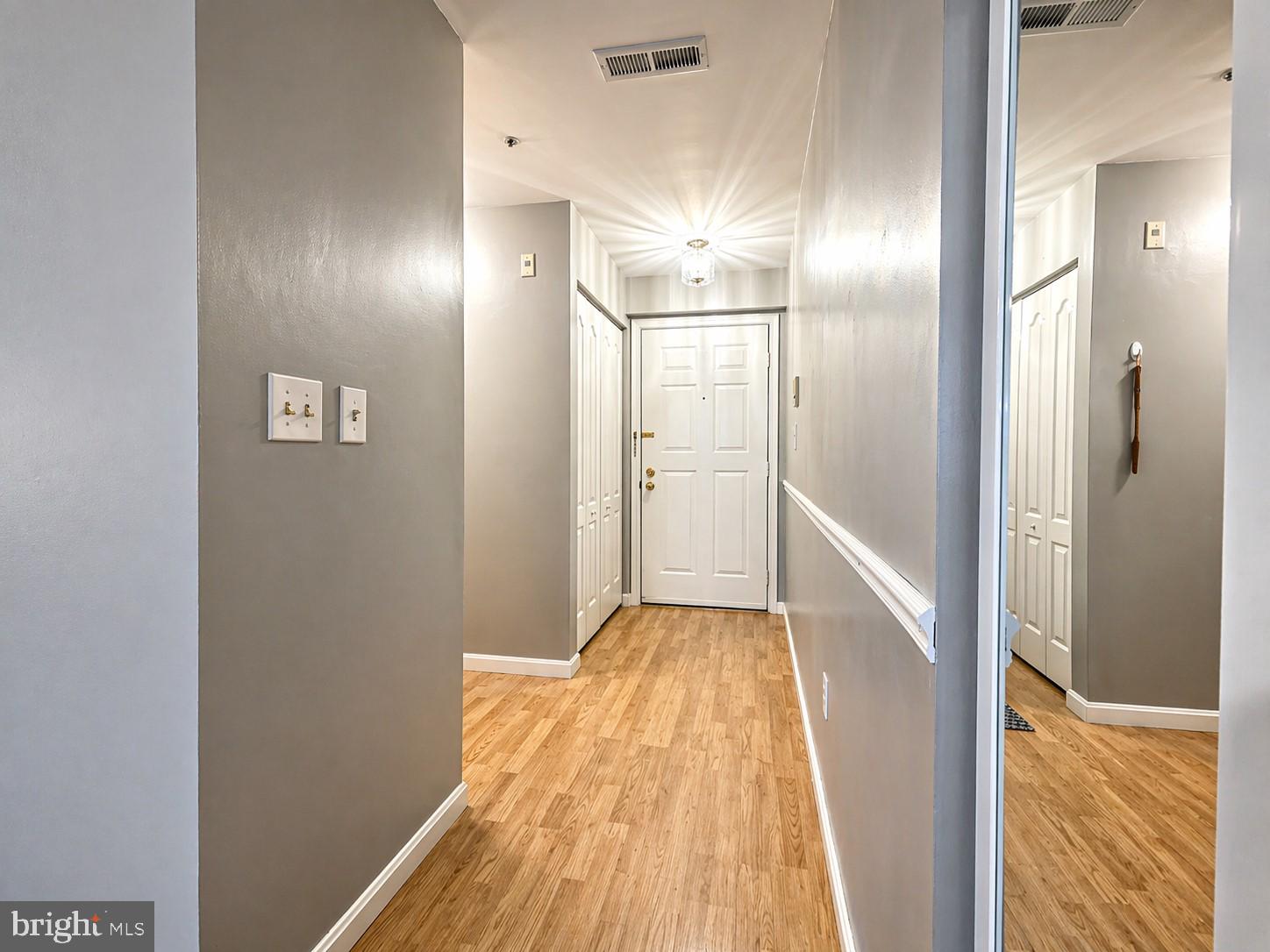 8353 Montgomery Run Road, Unit F Ellicott City, MD 21043 - Photo 4 of 25 a view of hallway with wooden floor