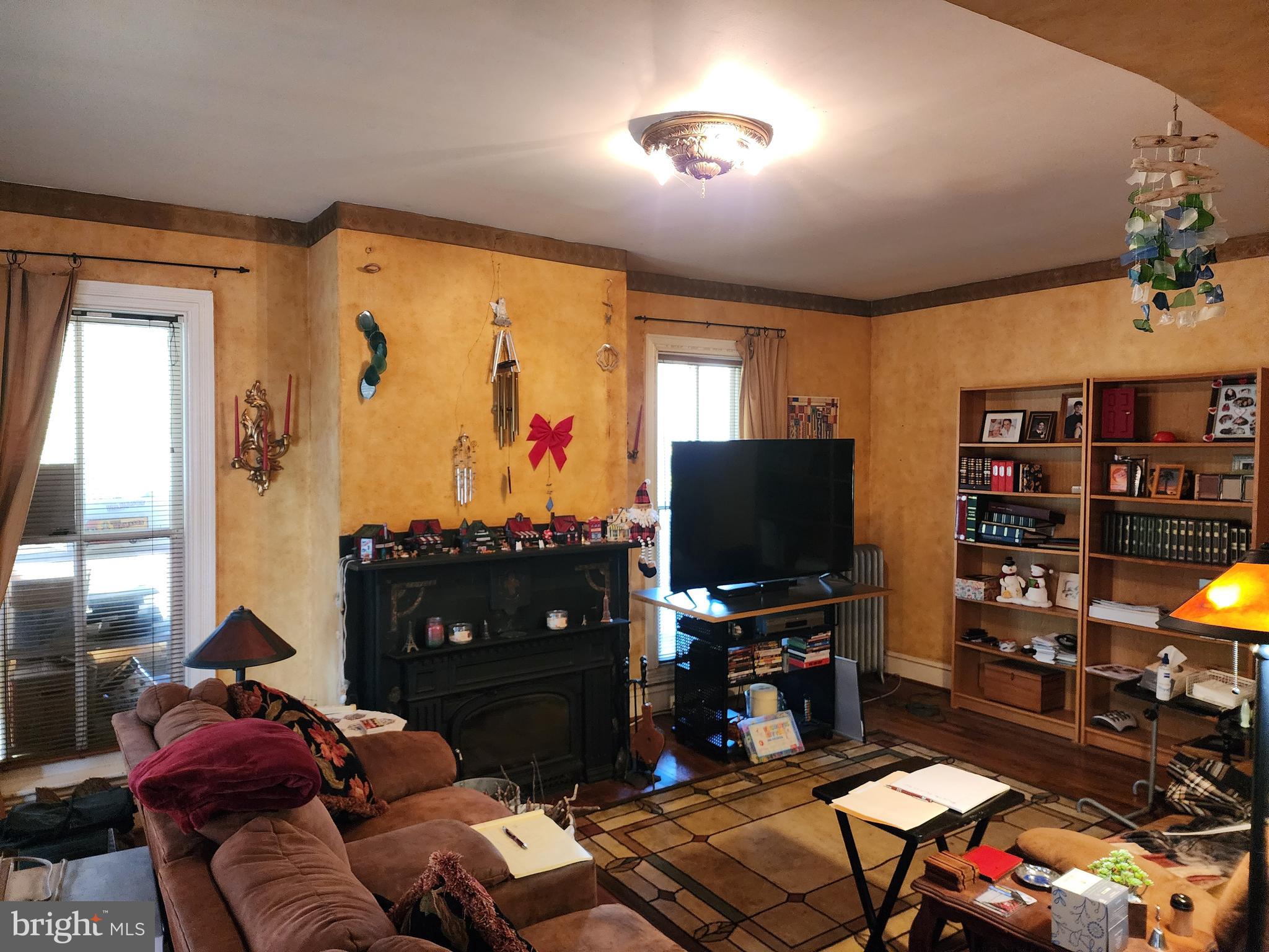 2307 Cooper Road Atco, NJ 08004 - Photo 13 of 47 a living room with furniture and a flat screen tv with bookshelf