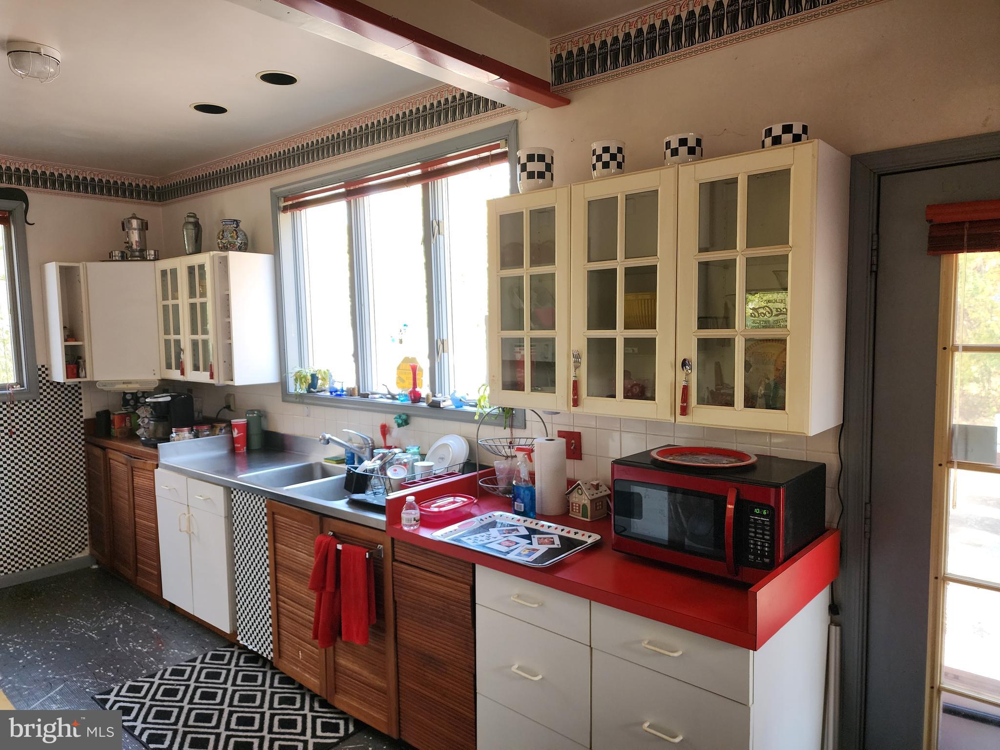 2307 Cooper Road Atco, NJ 08004 - Photo 14 of 47 a kitchen with stainless steel appliances granite countertop a stove and a sink
