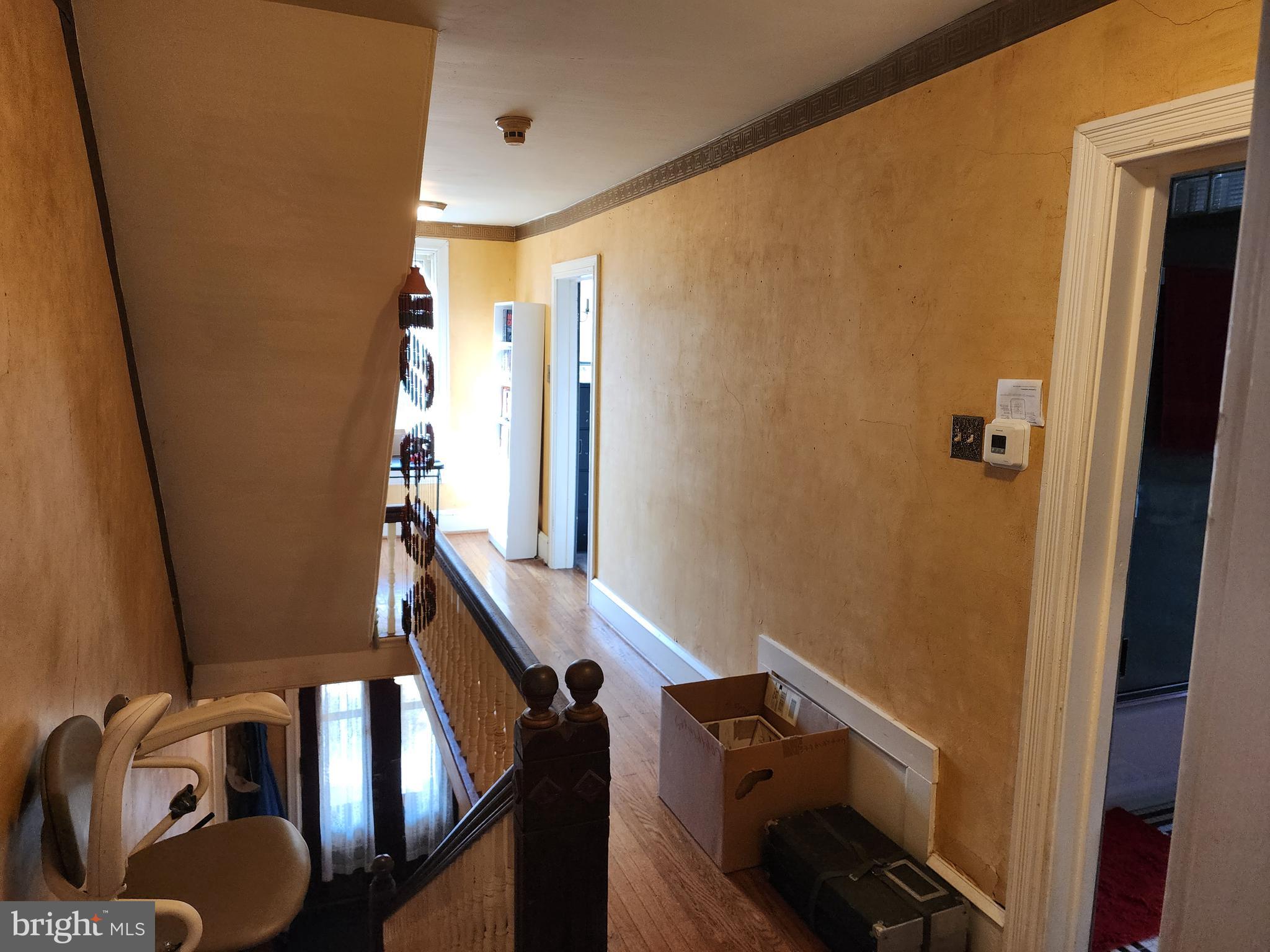 2307 Cooper Road Atco, NJ 08004 - Photo 27 of 47 a view of stairs and an empty room with wooden floor