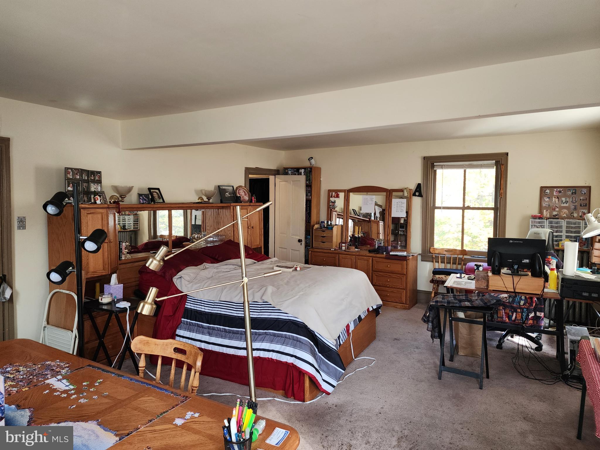 2307 Cooper Road Atco, NJ 08004 - Photo 30 of 47 a bedroom with a bed table chair and a window