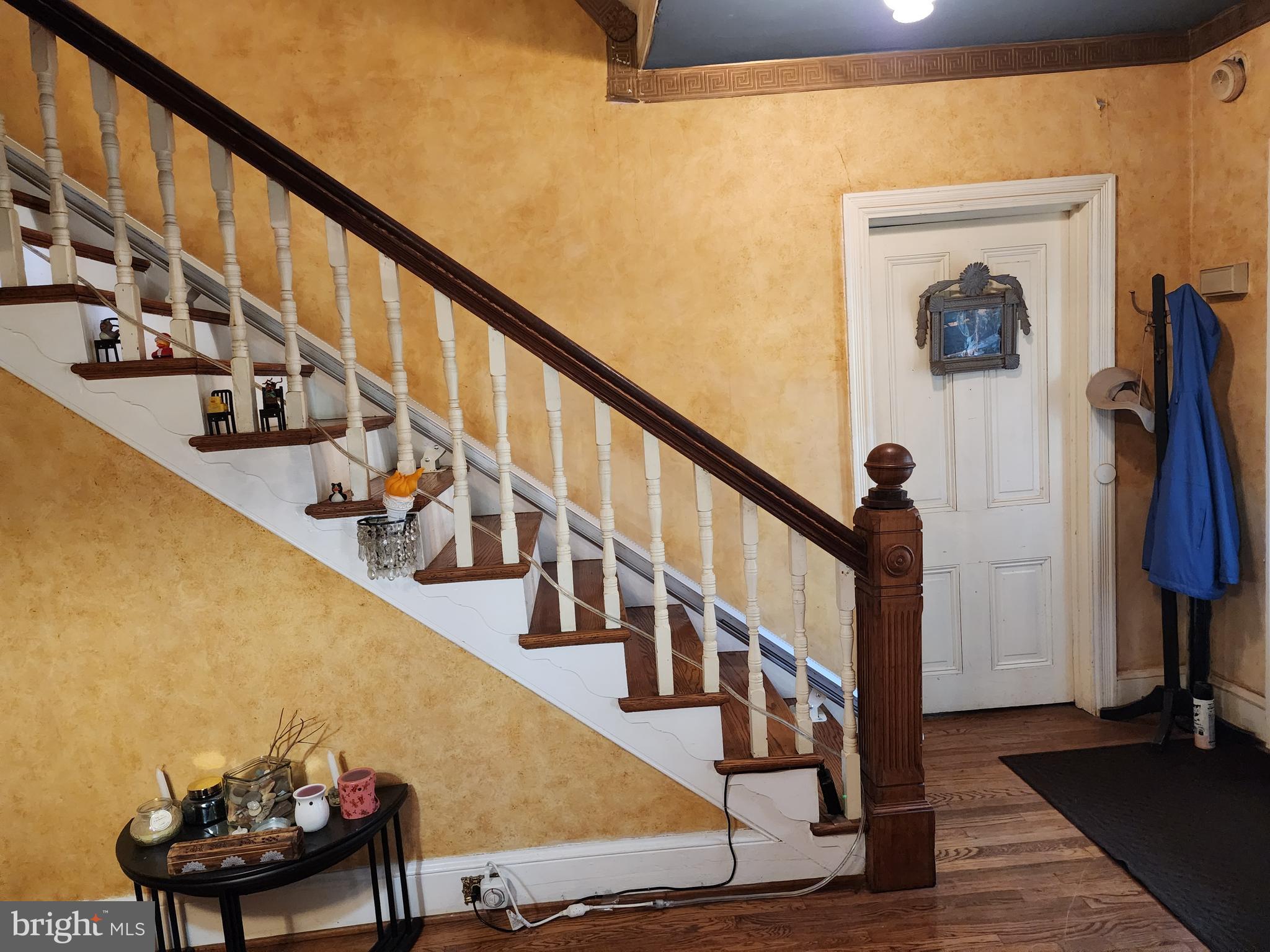2307 Cooper Road Atco, NJ 08004 - Photo 9 of 47 a view of a hallway with wooden floor and stairs