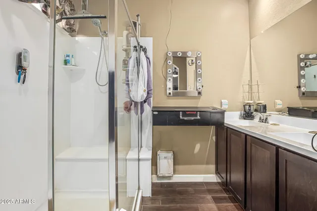 a bathroom with a double vanity sink and mirror