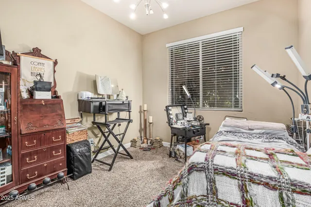 a bedroom with furniture and a window