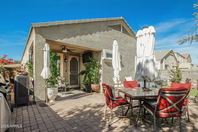 a view of a dinning table and chairs in the patio