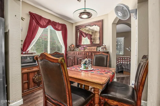 a view of a dining room with furniture window and wooden floor