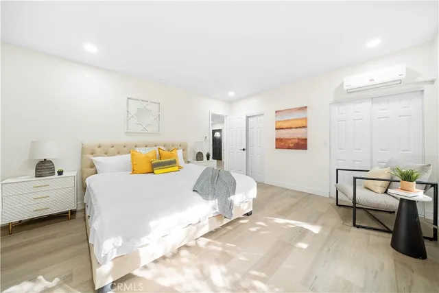 a bedroom with a bed and a window