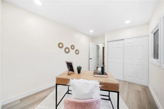 a workspace with furniture and wooden floor