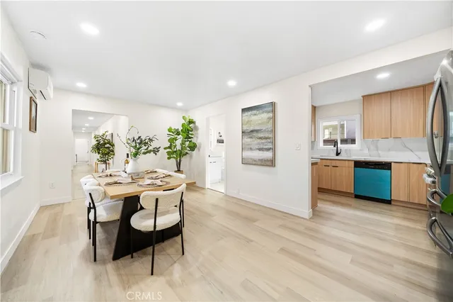 a kitchen with a table and chairs in it
