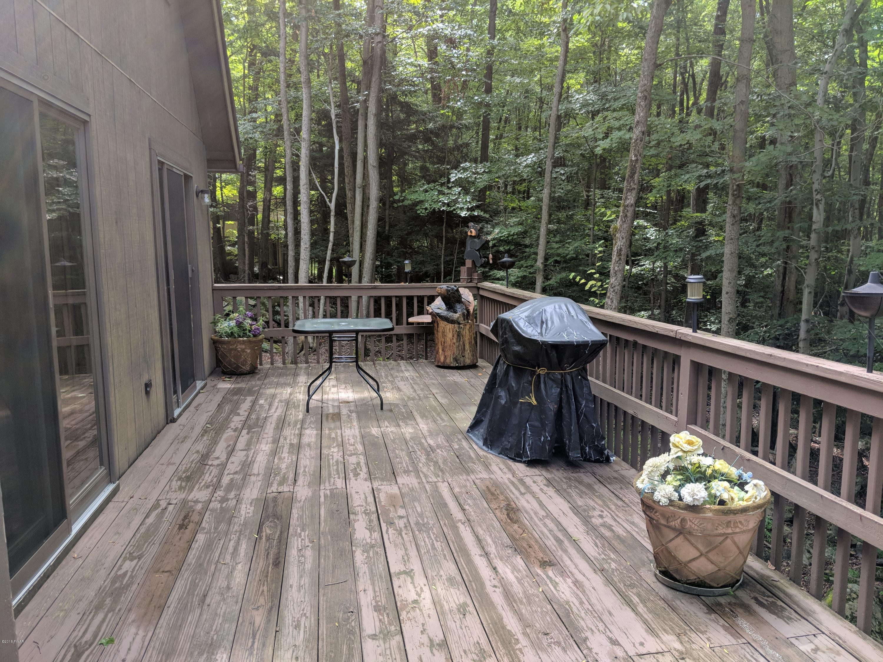 2597 Boulder Road Lake Ariel, PA 18436 - Photo 6 of 27 a view of a deck with furniture and garden