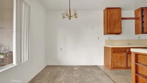 a kitchen with a stove and a refrigerator