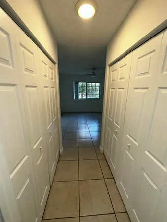 a view of an empty room and a window