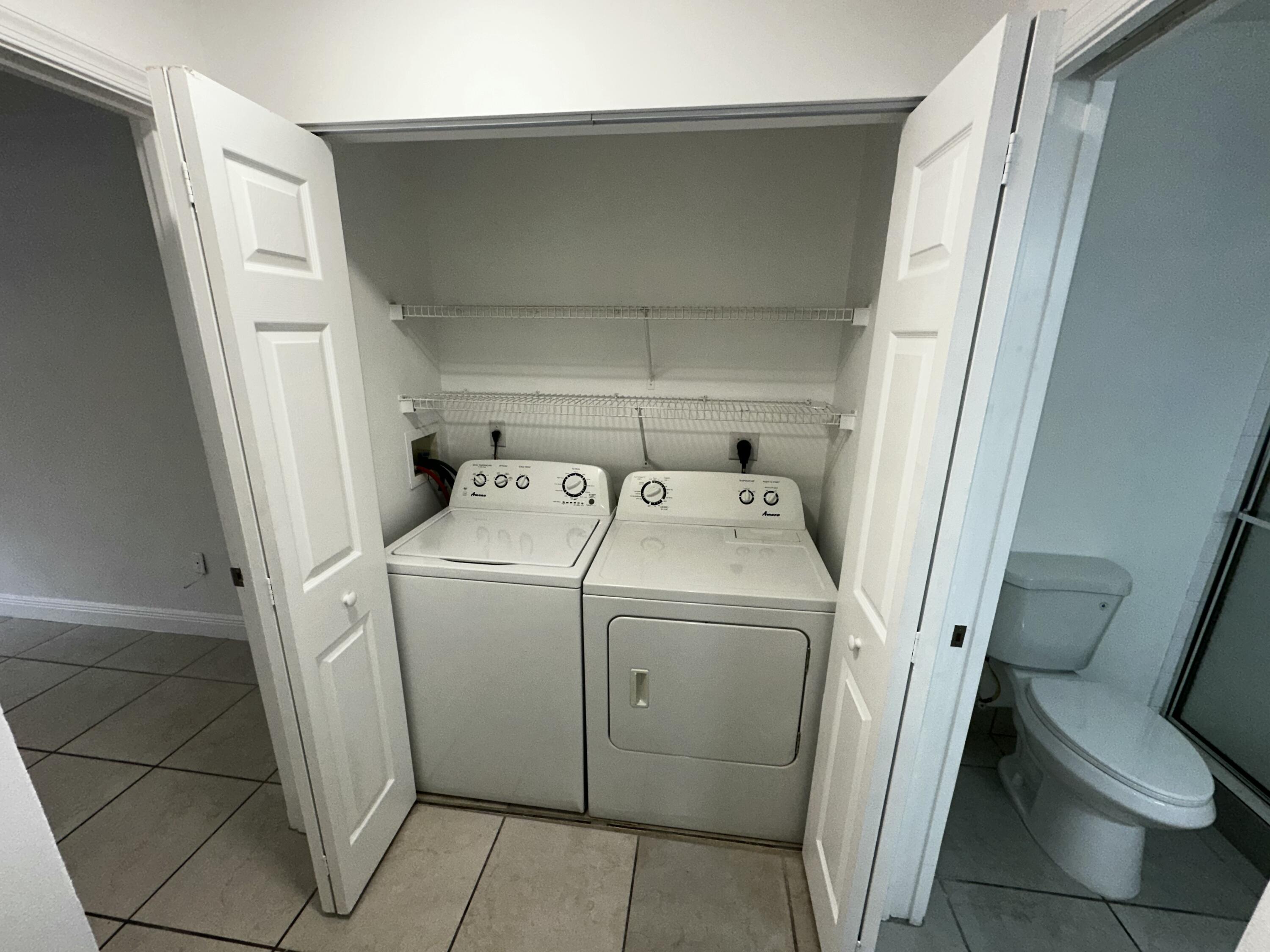2103 Renaissance Boulevard, Unit 306 Miramar, FL 33025 - Photo 18 of 44 a utility room with dryer and washer