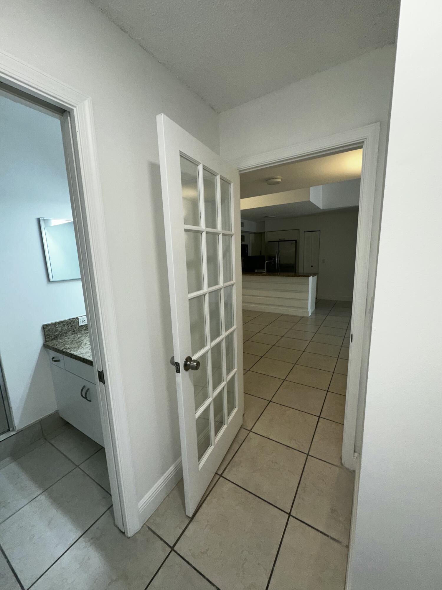 2103 Renaissance Boulevard, Unit 306 Miramar, FL 33025 - Photo 24 of 44 a bathroom with a shower and a toilet