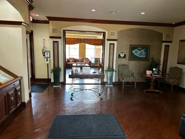 a view of a swimming pool with an outdoor seating and a yard